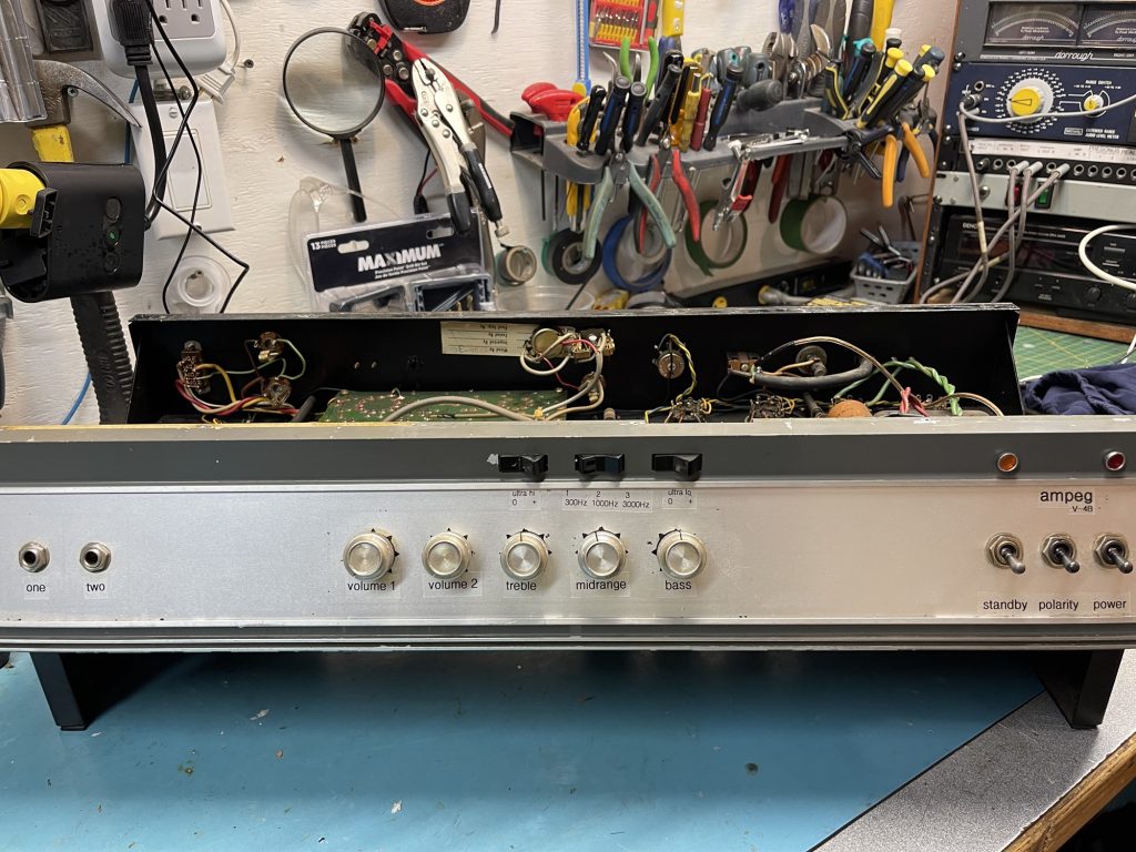 Ampeg V-4B bass amplifier without cover on my workbench.