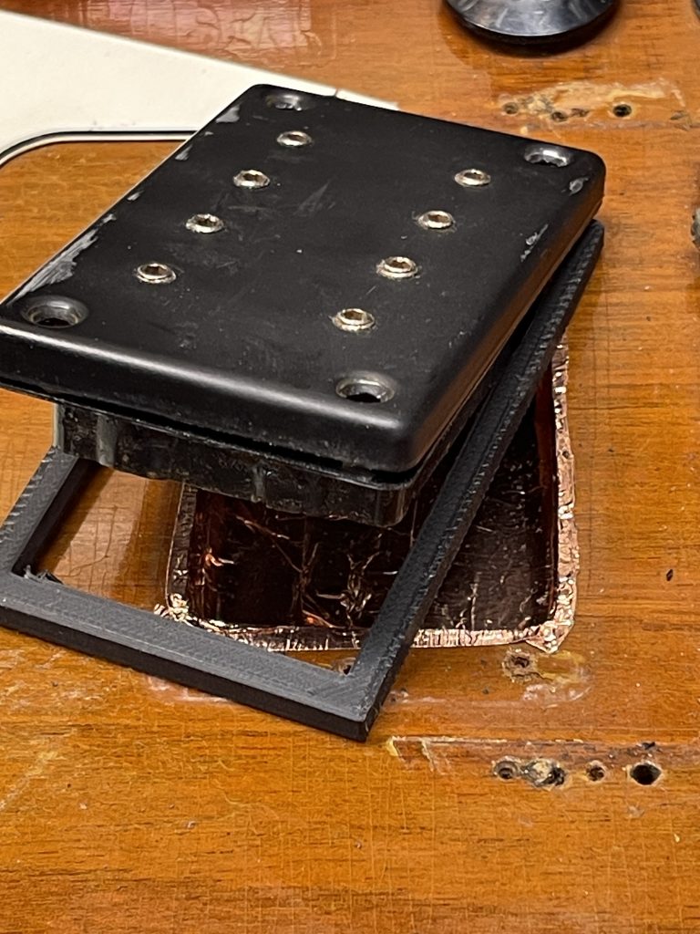 Dimarzio bass pickup installed by the owner at the time. I added a 3D printed spacer to elevate the pickup.